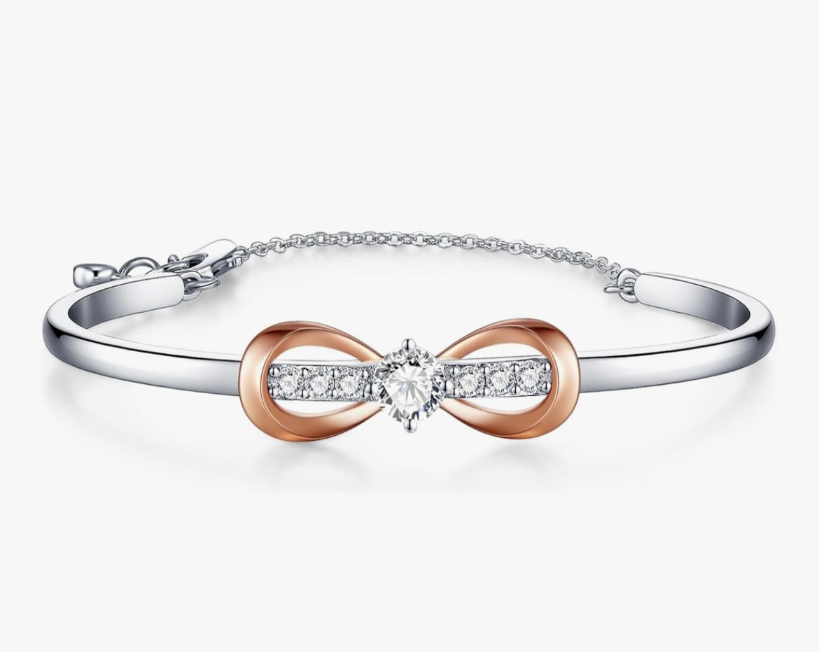 Two-toned 18k white gold infinity bow bracelet